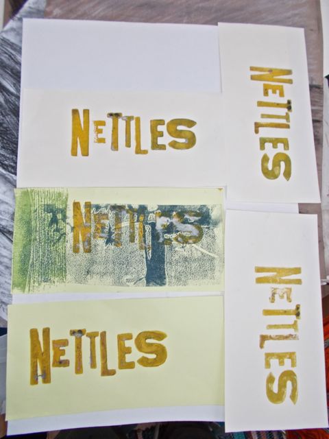 Brick-shaped pieces of paper, all printed with the word Nettles.
