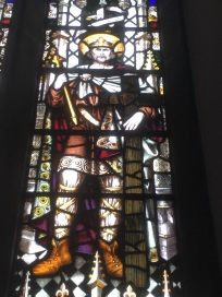 Detail of stained glass window depicting Saint Oswald, the Northumbrian warrior king.